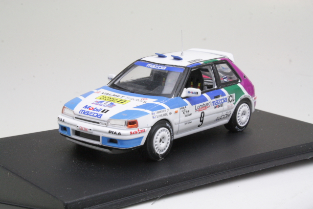 Mazda 323 GTX 4WD, RAC 1991, T.Mäkinen, no.9 "B-LAATU" - Sulje napsauttamalla kuva